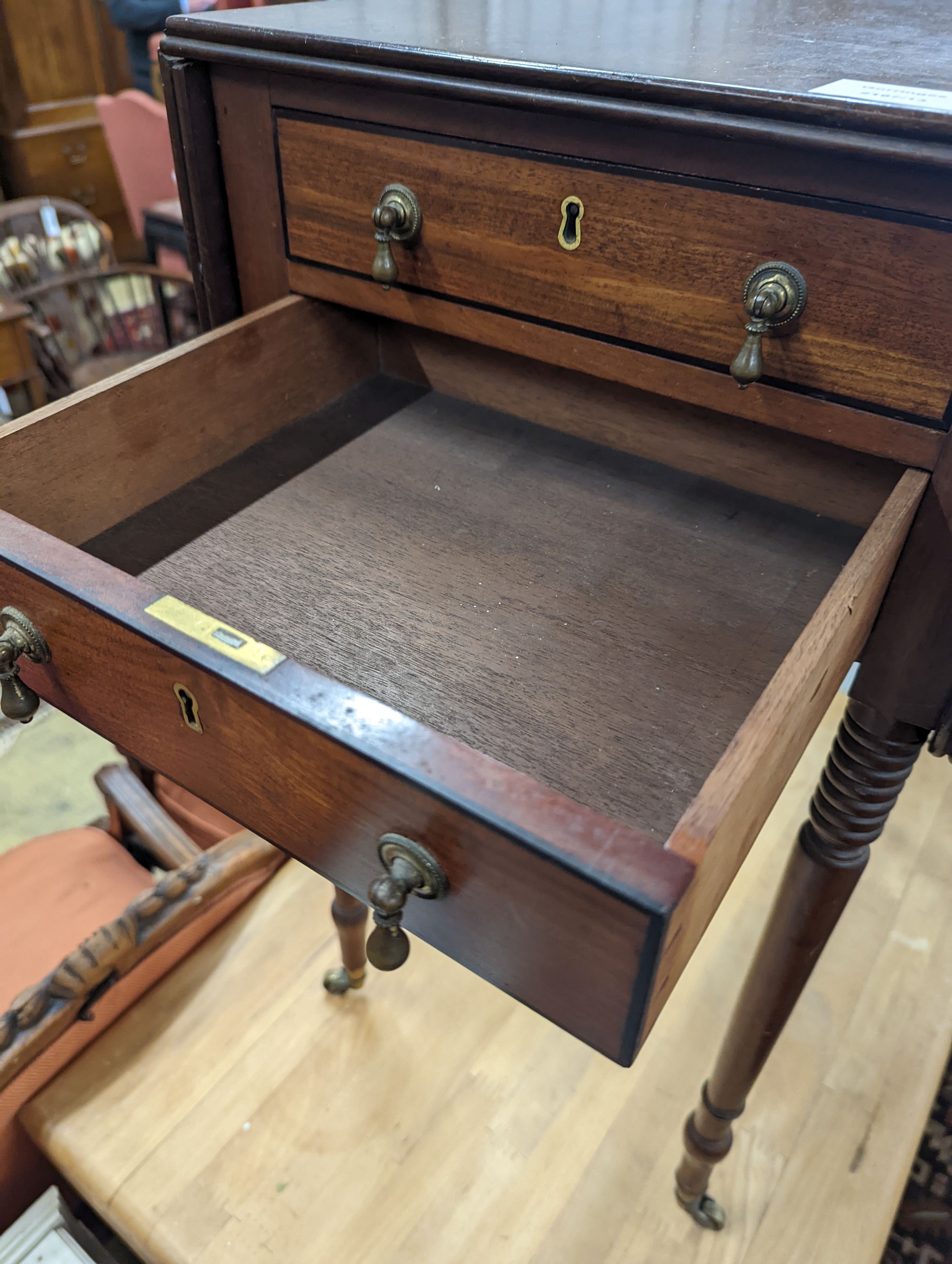 A Regency mahogany drop flap work table, the drawers with brass pear drop handles, width 37cm, depth 53cm, height 73cm